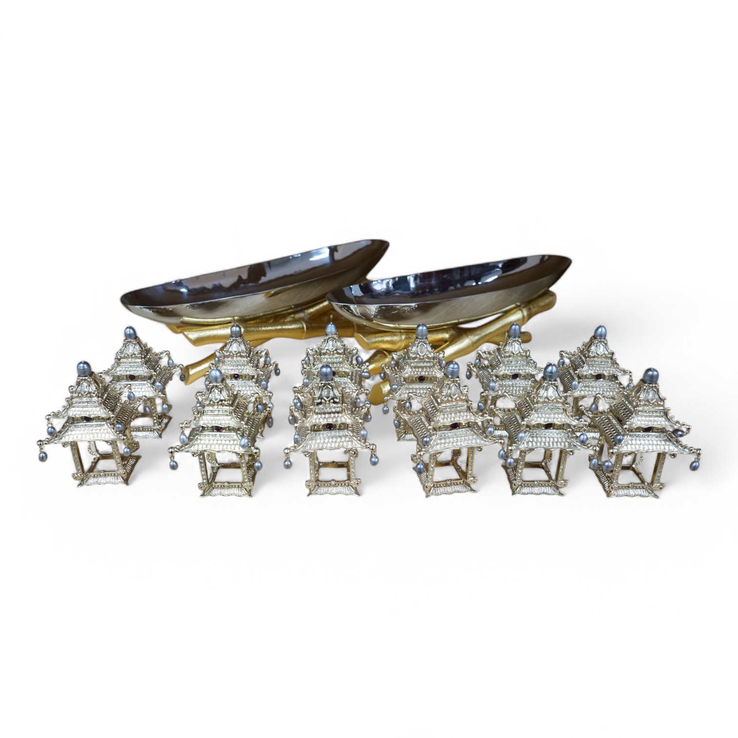 A group of L’objet gilt metal table decorations; twelve decorative ‘Chinese pagoda’ freshwater pearl and Swarovski crystal mounted napkin rings, and two dishes on faux bamboo stands. Condition - good.